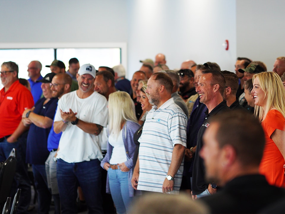 a group of people standing in front of a crowd