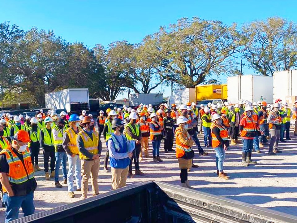 a group of people standing in front of a crowd