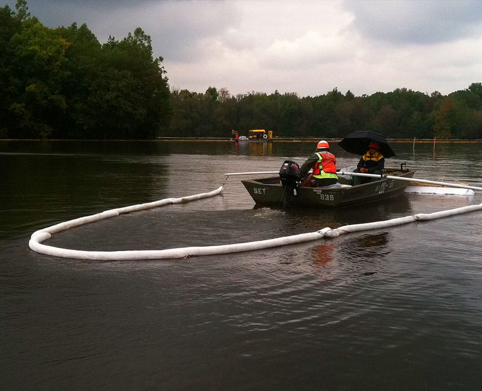 a man rowing a boat in a body of water